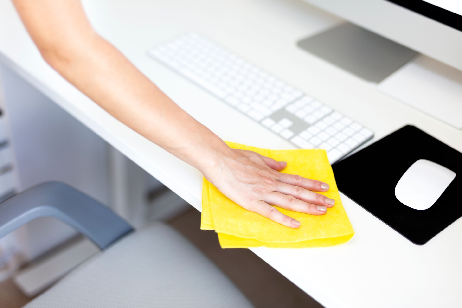 Woman is Cleaning an Office Table